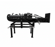 The Paddock Tractor 3pt Mount Log Splitter by Paddock is a black metal industrial attachment with hydraulic hoses and four support legs, designed for mounting on heavy machinery as a dual-action log splitter, shown against a white background.