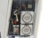 Close-up of the Paddock Diesel Inverter 5kW Generator control panel featuring switches, keys, two covered 15A outlets, volt meter display, indicator lights, and a 50 Hz label—perfect for emergency backup.