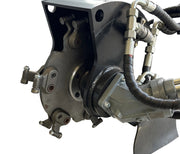 Close-up of the Paddock Swinging Stump Grinder Attachment – Suits STRKL1200, showing metal hydraulic components, hoses, bolts, and fittings; ideal as a Paddock mini loader accessory, isolated on a white background.