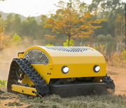 The Paddock Remote Controlled Mower 7.5HP - 530mm, by Paddock, operates autonomously across dry grass outdoors, with trees and shrubs in the background under natural light.