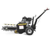 Side view of the Paddock Walk Behind Trencher with Guide Wheel, featuring a long rotating blade, two large wheels, handlebar for manual operation, black and yellow Paddock branding, safety labels, and a reliable Briggs & Stratton engine.