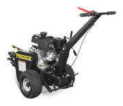 The Paddock Walk Behind Trencher with Guide Wheel features large rugged tires, a powerful Briggs & Stratton engine, and a long handle with red grip—delivering performance similar to a stump grinder for tough digging tasks.