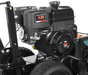 Close-up view of a Paddock Walk Behind Trencher with Guide Wheel, featuring a Briggs & Stratton XR 13.5 HP engine, visible engine components, tires, and part of the sturdy black machine frame.