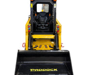 A Paddock Tracked Cabin Loader Pro with a 40hp Perkins turbo diesel engine (ex demo) is shown from the front, featuring the operator’s seat, controls, and large black bucket—ideal for heavy-duty construction tasks.