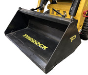 A close-up of a Paddock Tracked Cabin Loader Pro with yellow cabin, black tracks, and front bucket. Features include a 40hp Perkins Turbo Diesel engine. 