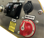 Close-up of a Paddock Tracked Mini Loader Pro control panel (40hp Perkins Turbo Diesel) with labeled switches—HEADLIGHT, AUTO HOLD, E-BRAKE—a red MAIN SWITCH dial (OFF), 12V socket, and yellow notice; perfect for construction companies.