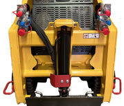 Front view of a yellow Digga attachment plate for Paddock Tracked Mini Loader Pro (40hp Perkins Turbo Diesel), showing hydraulic connections, safety labels, black hoses, and red/blue couplers—compatible with Paddock mini loaders.