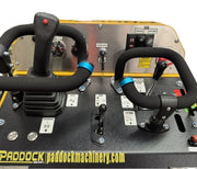 The Scintex Paddock Tracked Mini Loader – Diesel Engine features a control panel with padded handles, joystick, buttons, switches, and instructions. Compatible with multiple attachments for versatile use. Showcases paddockmachinery.com branding.